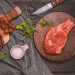 Preparing a steak in Harper's Steakhouse